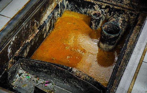 procrastinating on grease trap cleaning can result in foul odors, clogs, and even fines for non-compliance with regulations